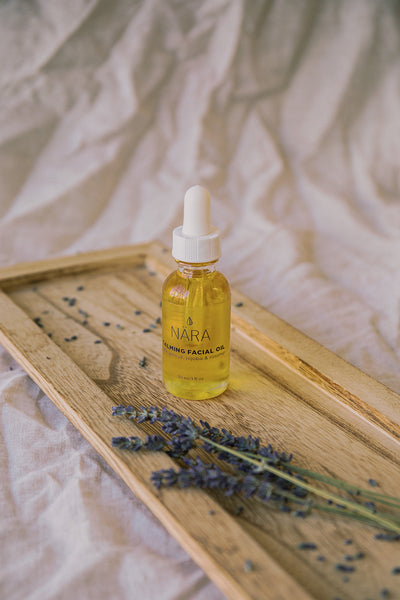 Calming Face Oil Bottle and Fresh Lavender
